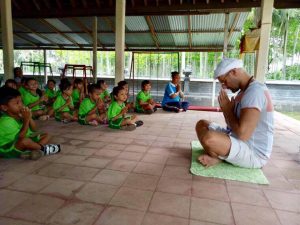 Simon our massage therapist practicing kundalini yoga in Bali